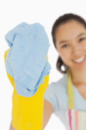 laughing-woman-cleaning-with-cloth-wearing-rubber-gloves-and-apron