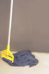 dirty mop on wall