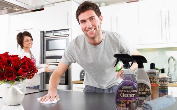 Young Couple Cleaning Cleaning Modern Kitchen